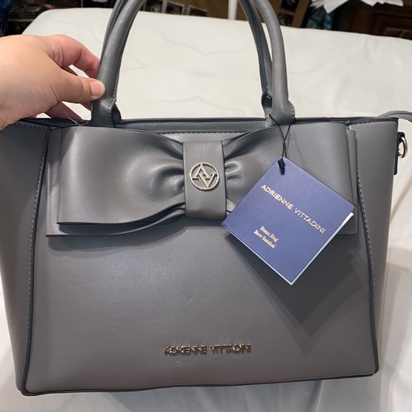 Purse with bow design on front. Brand new with tag. Gray purse. - Picture 16 of 16